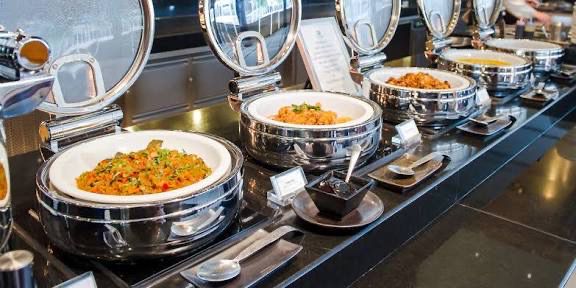 Pristine polished steel buffet setup for a corporate event